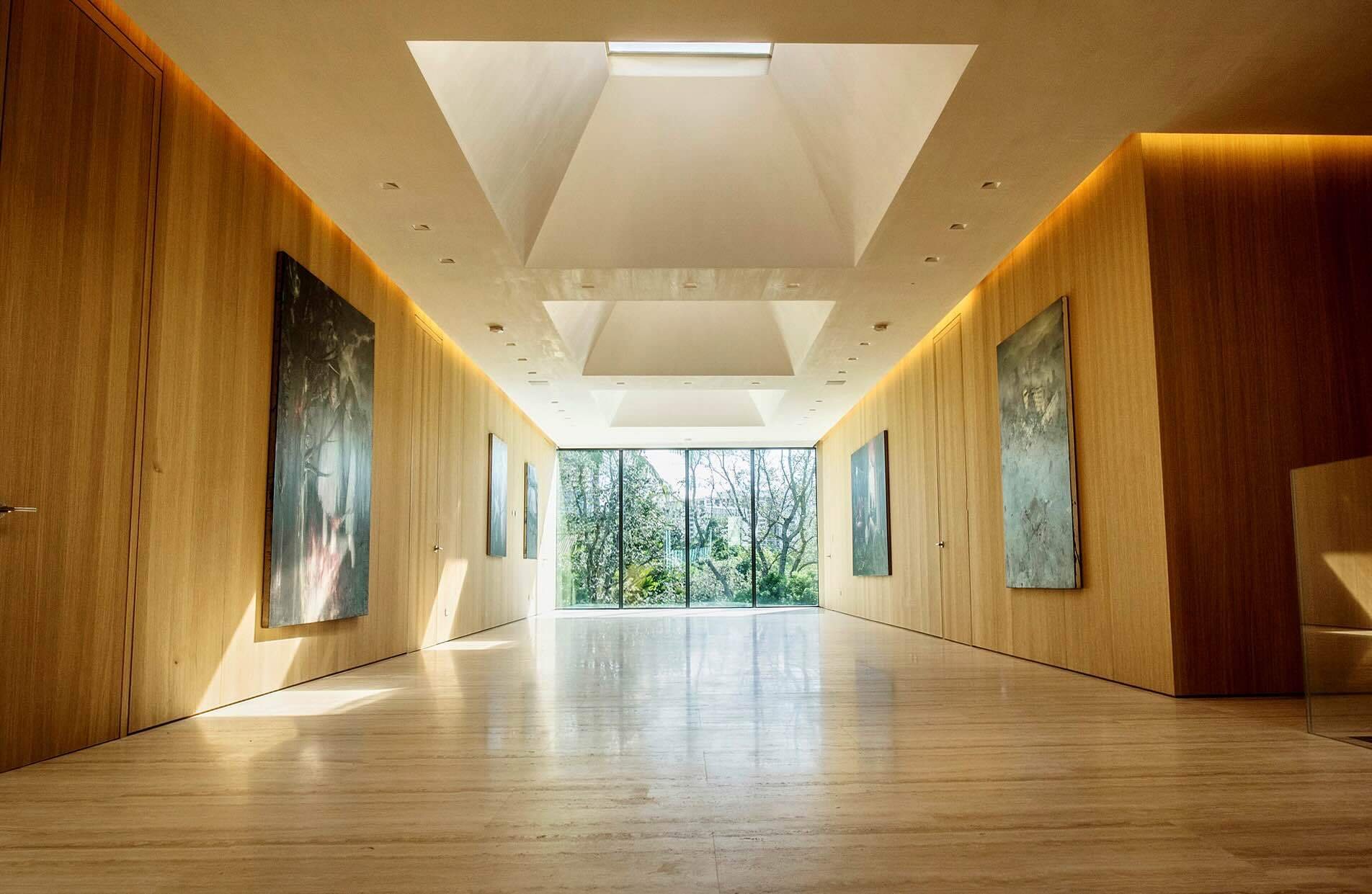 Hallway with elegant, seamless wood paneling made in Italy