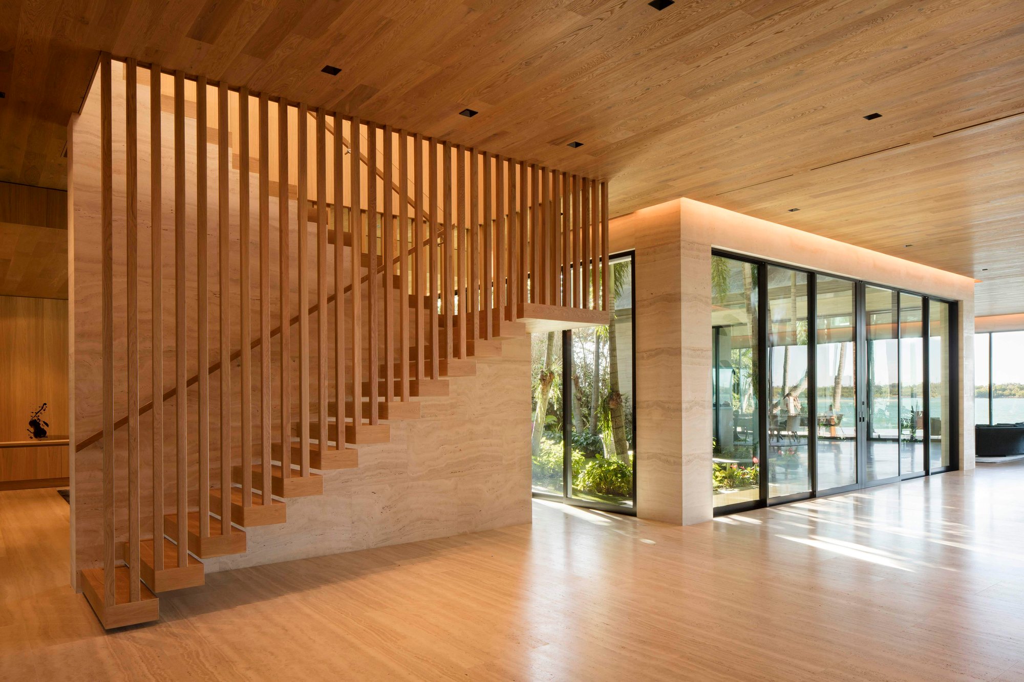 Luxury indoor staircase with wooden balusters made in Italy